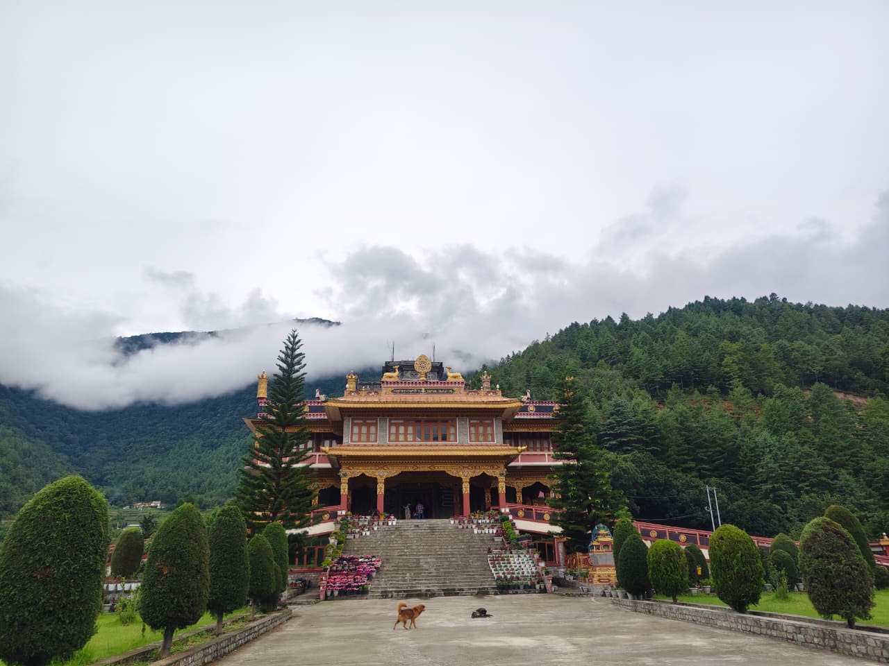 Tiered roofs and painted woodwork of a traditional Monpa monastery building